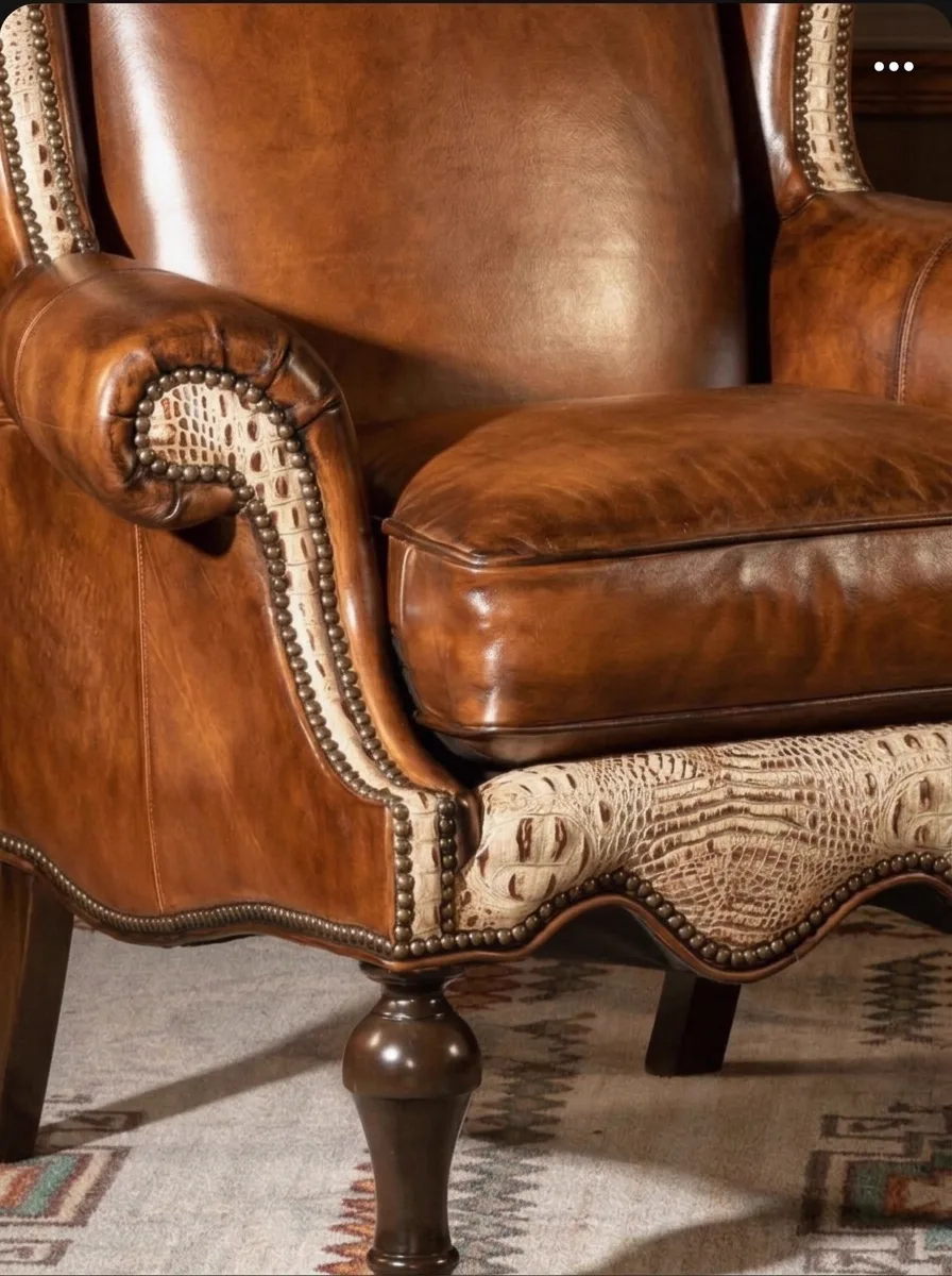 Whisky-tan leather wingback club chair after cleaning and conditioning